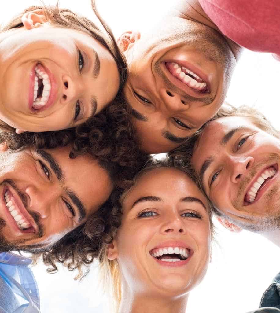 Smiling person showcasing white teeth after laser whitening treatment Milton Keynes